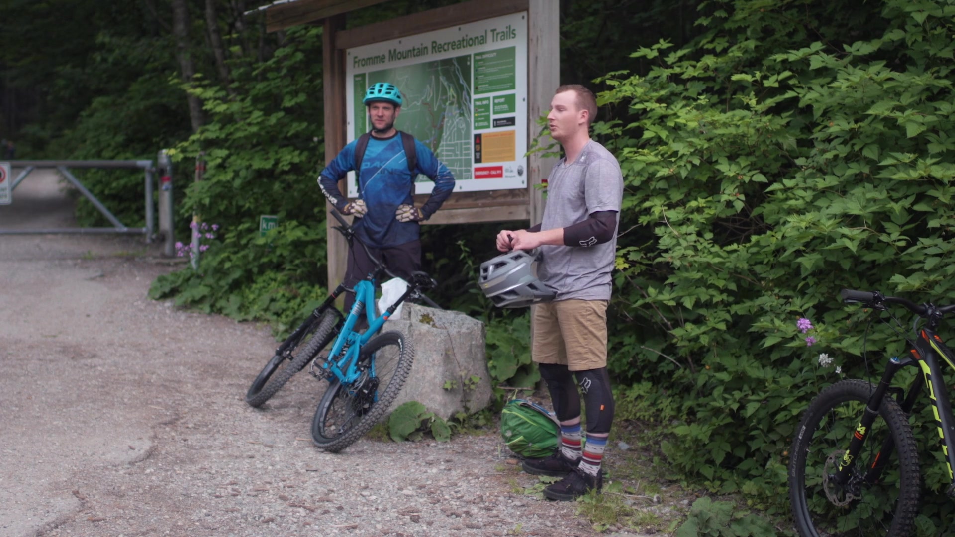 Danny meeting a cyclist beside a forest trail