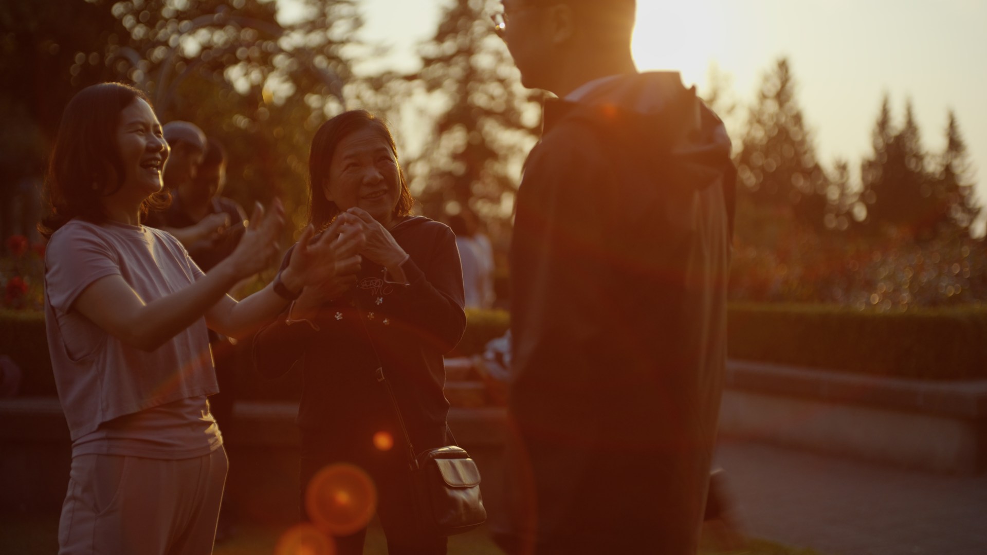 People gathered outdoors in warm evening light