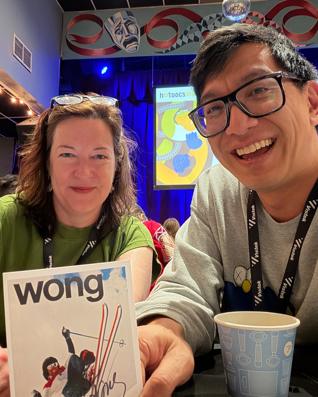 Two team members at a Hot Docs industry event with the film’s presentation materials